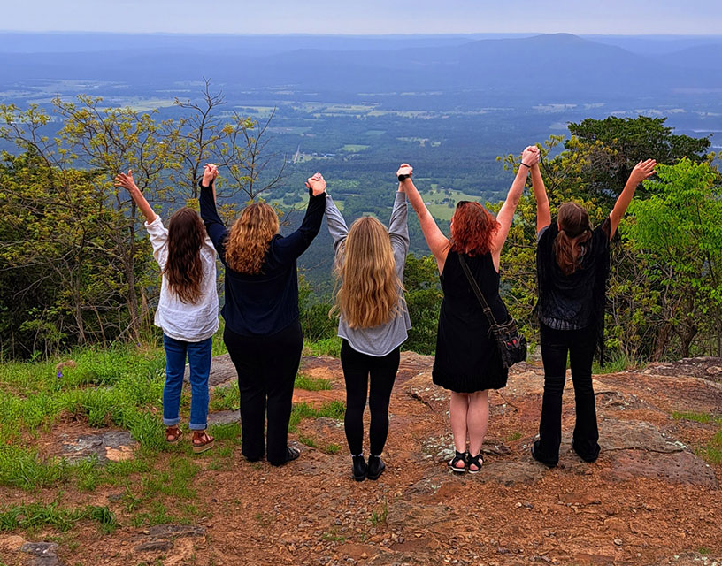 Women's Standing on mountain